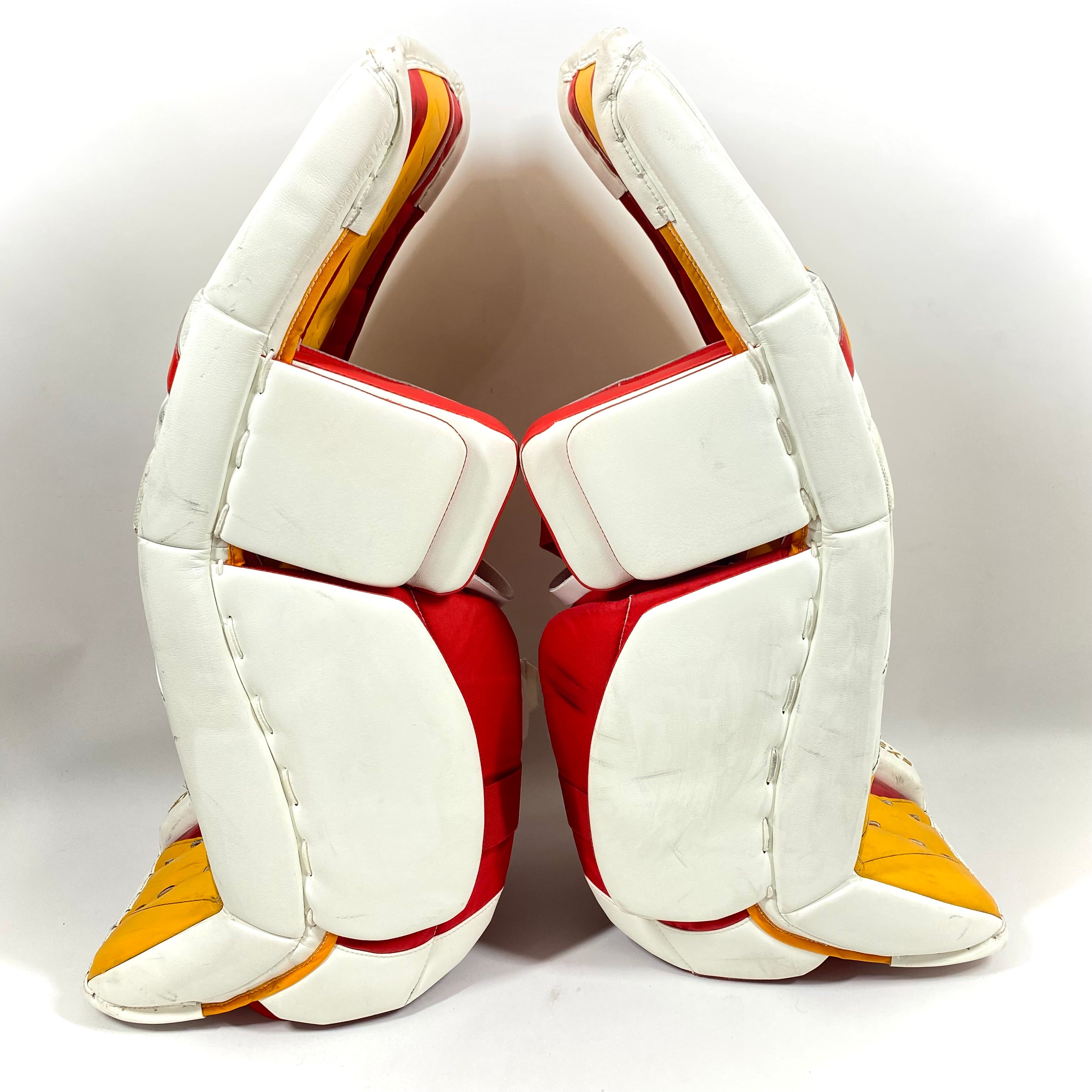CCM Extreme Flex 5 - Jambières de gardien de but AHL Pro Stock d'occasion (blanc/rouge/jaune)